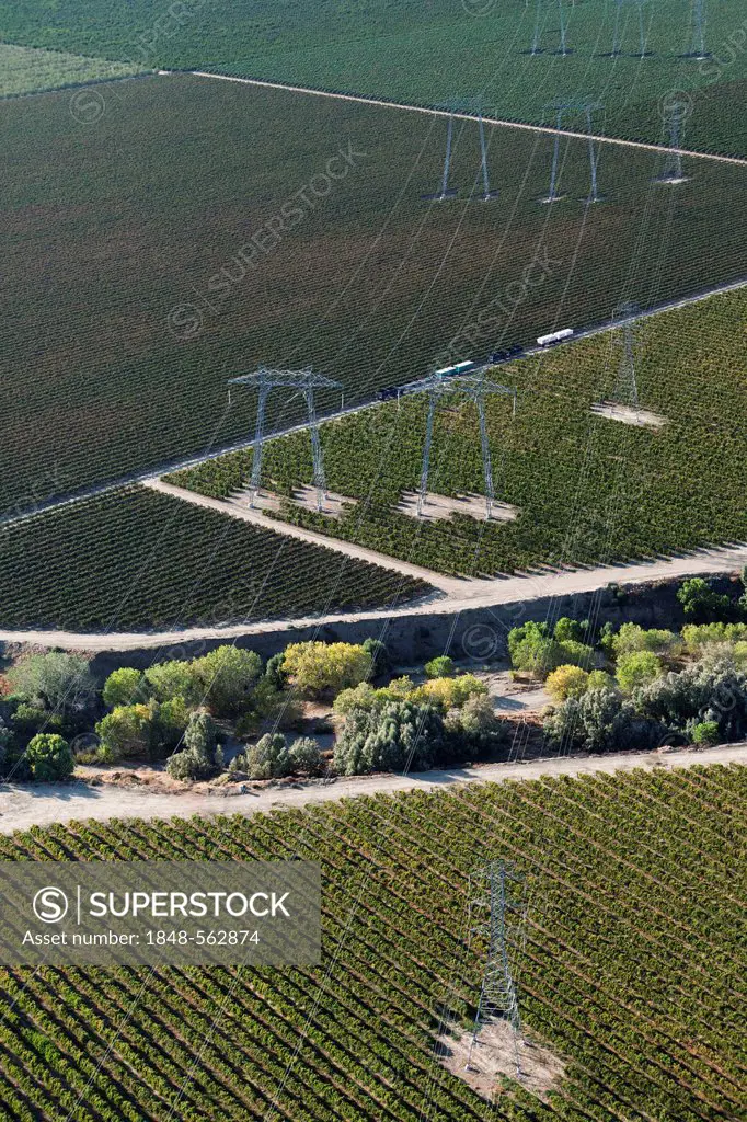 Aerial view, high voltage transmission pylons in the agricultural landscape of Central Valley, Huron, California, USA, North America
