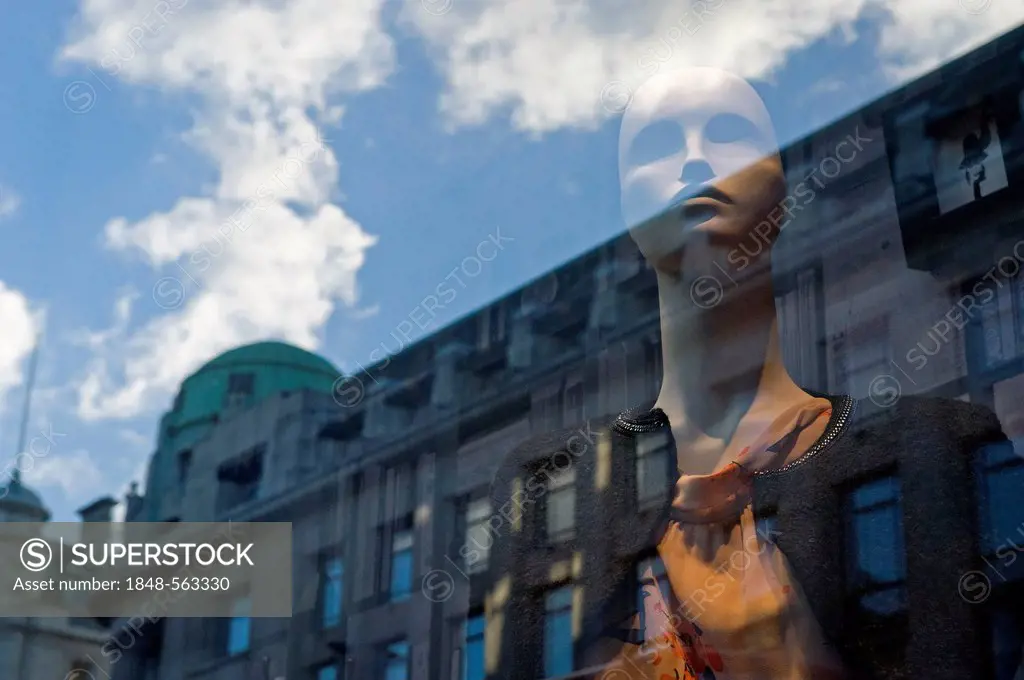 Mannequin in show window and reflections of buildings, Oxford Street, London, England, United Kingdom, Europe