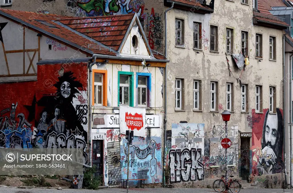 Condemned buildings in the historic district, painted with graffiti and an anti-Nazi slogan, alternative scene, Weimar, Thuringia, Germany, Europe