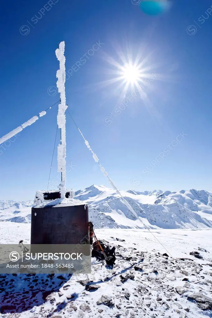Weather station on the summit of Mt Hintere Schoentaufspitze, Sulden in winter, Mt Zufallspitze and Mt Cevedale at back, South Tyrol, Italy, Europe