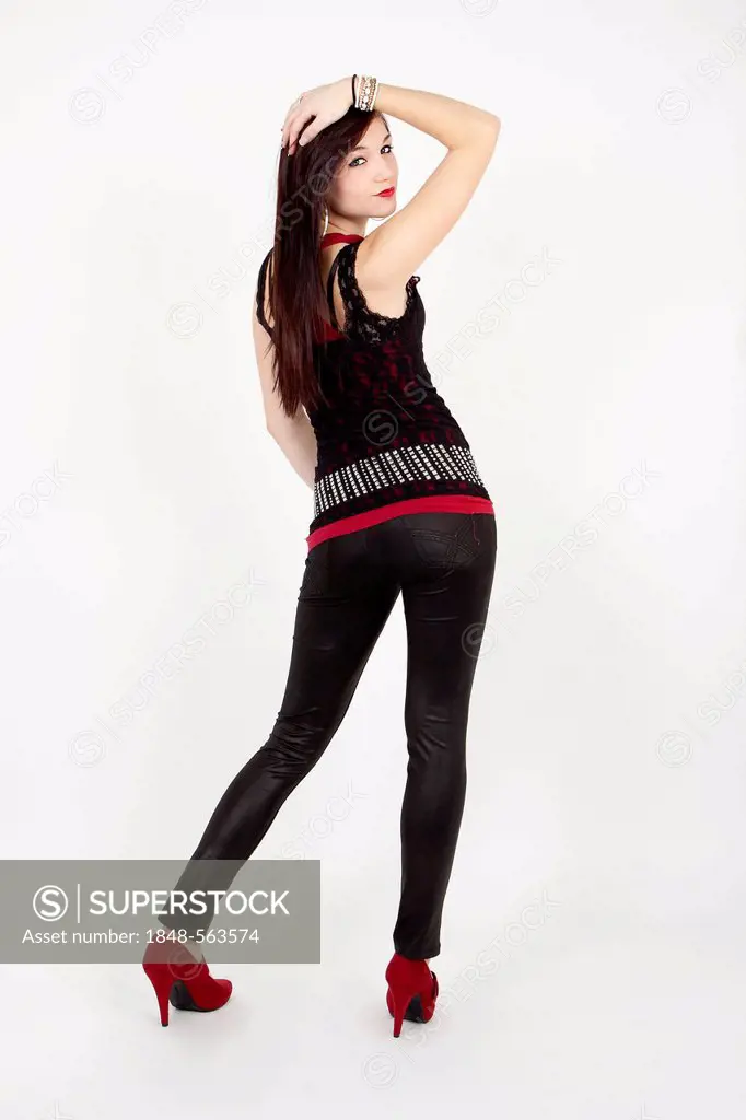 Young woman wearing a black top and black leggings