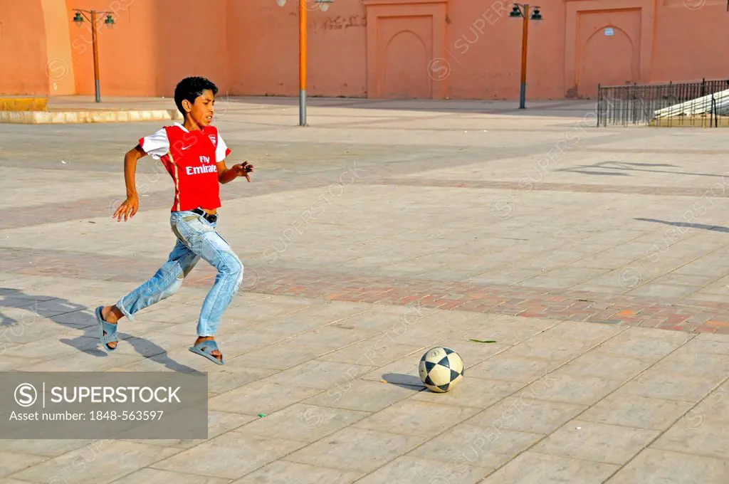 Boy playing football, Marrakech, Morocco, Africa, PublicGround