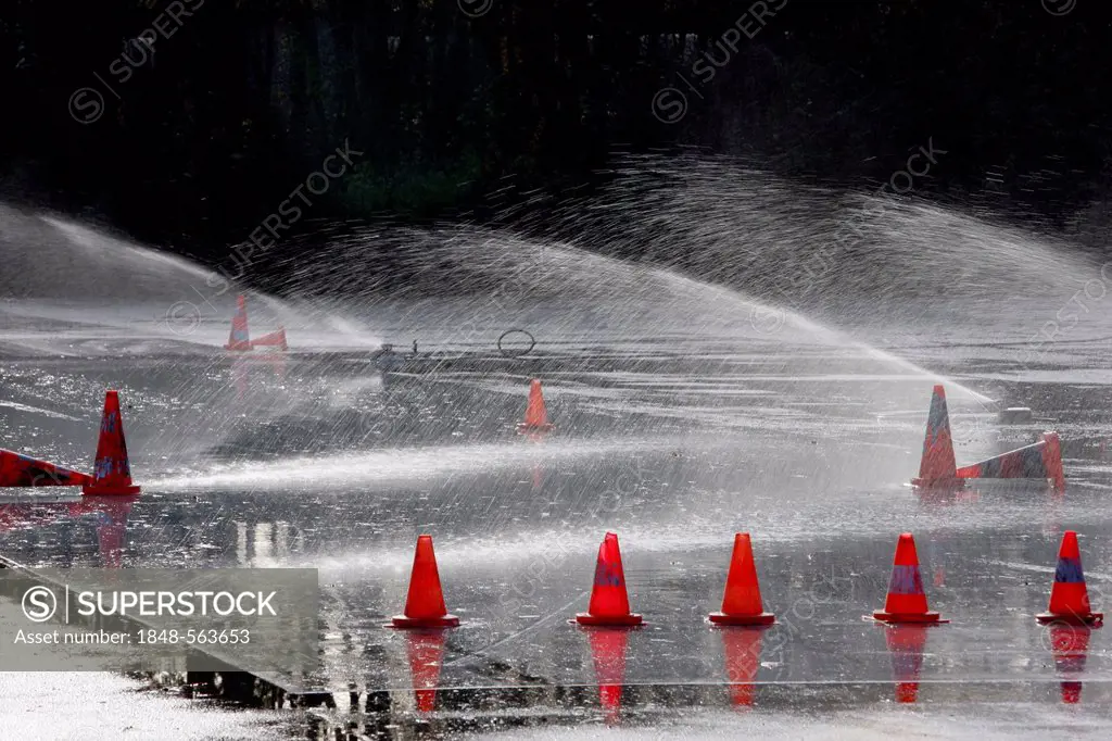 Artificial rainfall on a test route for drivers to test brakes on a wet surface, evasion movements and emergency stops, safety training, driver traini...