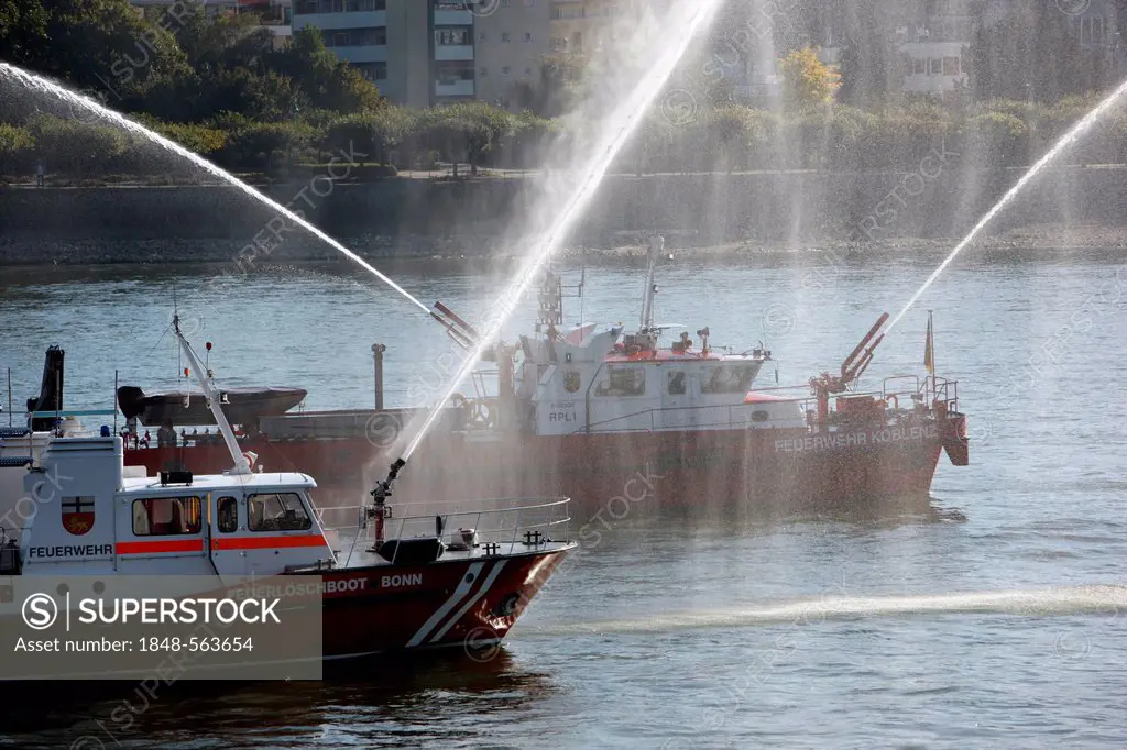 Fire fighting boats of the Bonn fire brigade on the Rhine with water jets from two cannon during a display, Bonn, North Rhine-Westphalia, Germany, Eur...