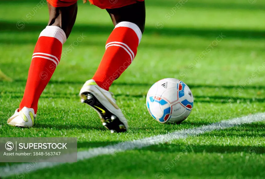 Legs and Nike shoes of a Duesseldorf player with the league ball, preparatory match for the second round of the tournament season 2011-2012, Fortuna D...