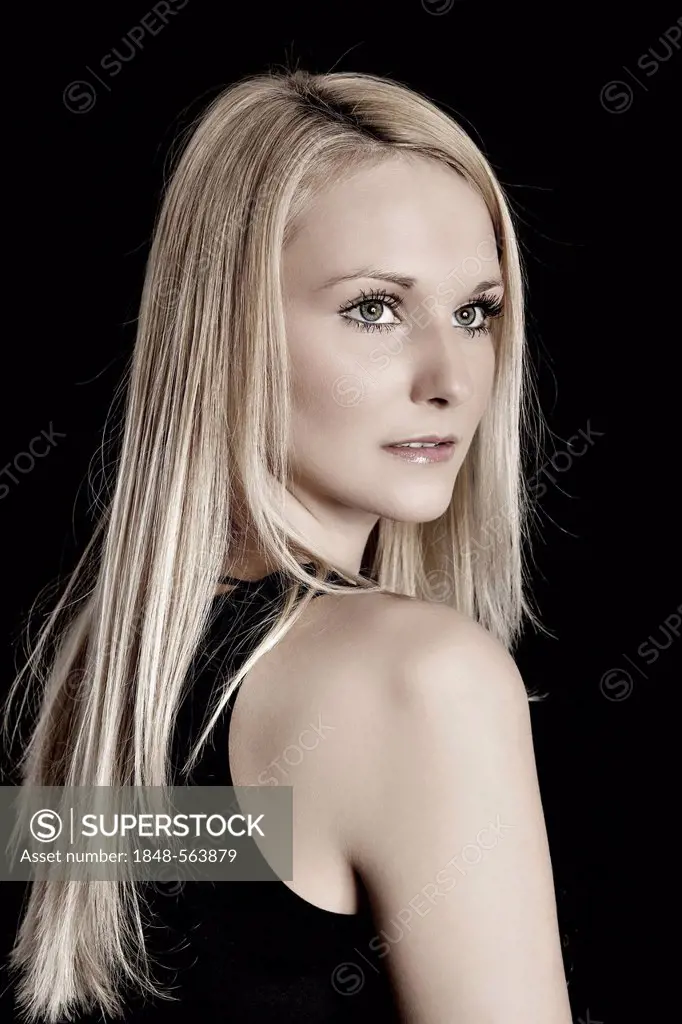 Blonde young woman looking to the side, portrait