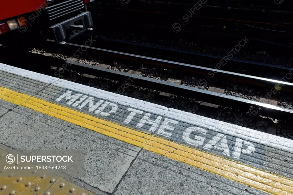 Arriving train and mind the gap sign, Turnham Green tube station, London, England, United Kingdom, Europe