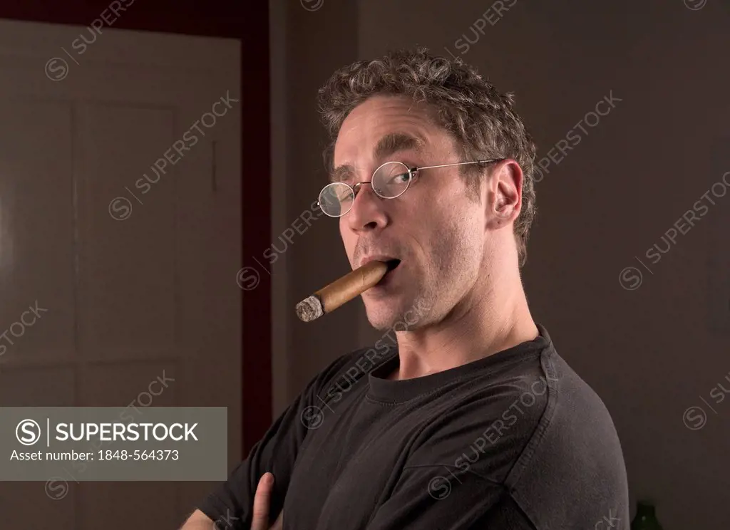 Young man with cigar, portrait