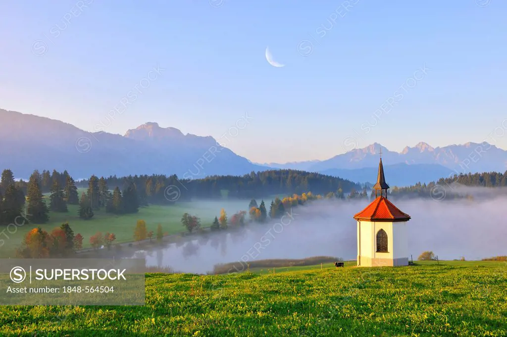 Chapel at Hegratsrieder See, lake, with moon, digital compising, near Fuessen, Allgaeu, Bavaria, Germany, Europe