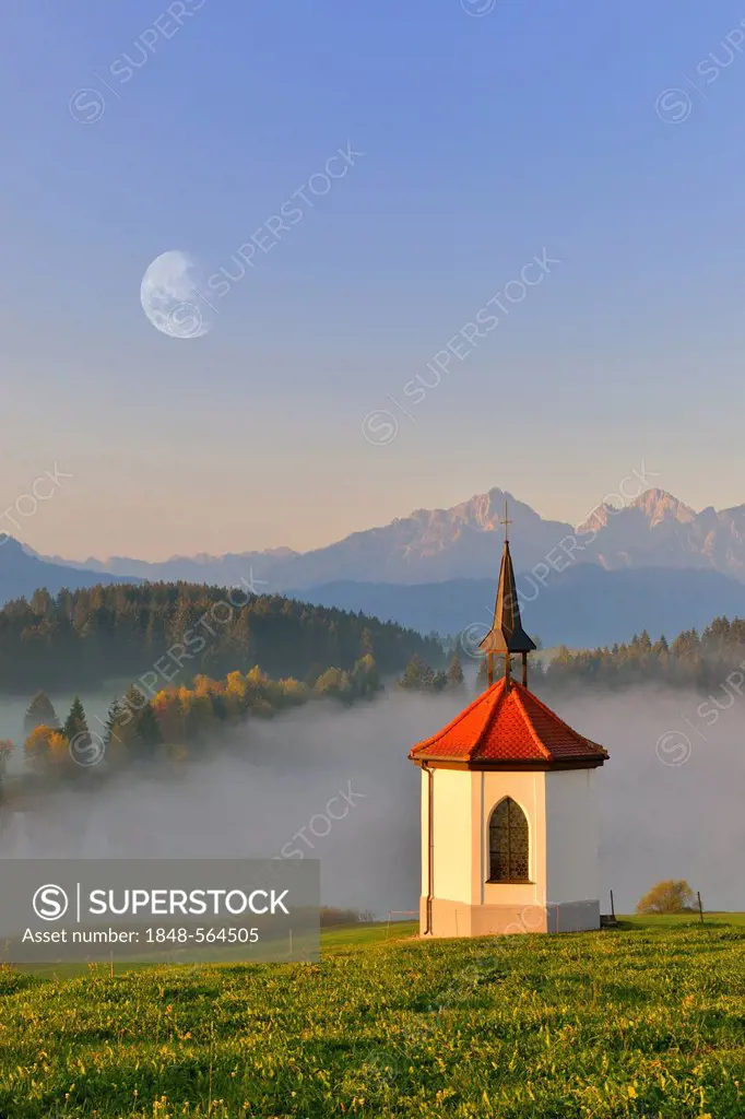 Chapel at Hegratsrieder See, lake, with moon, digital compising, near Fuessen, Allgaeu, Bavaria, Germany, Europe