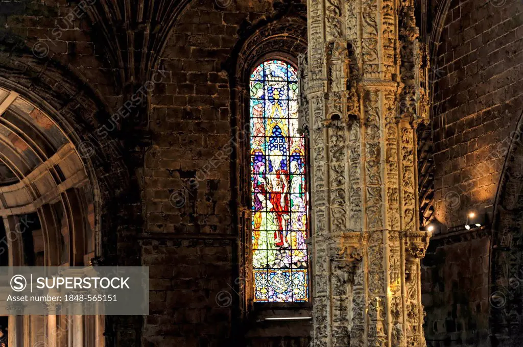 Colorful stained glass windows, Santa Maria Church, Mosteiro dos Jeronimos, Hieronymites Monastery, Unesco World Heritage Site, Belem district, Lisbon...