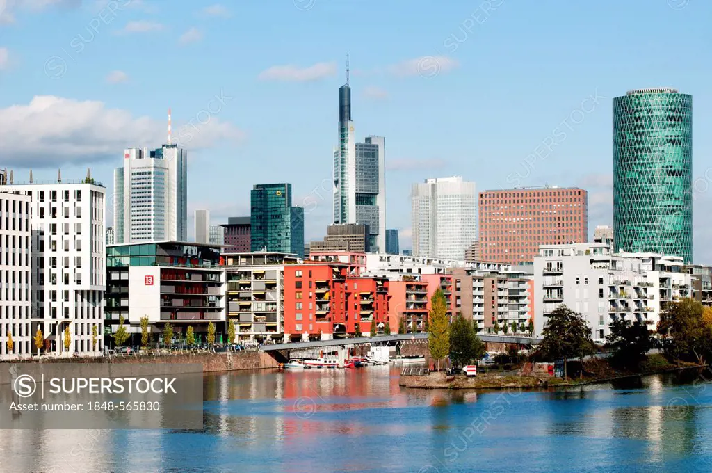 View of residential houses in the Westhafen harbour and skyscrapers in the financial district, Frankfurt am Main, Hesse, Germany, Europe
