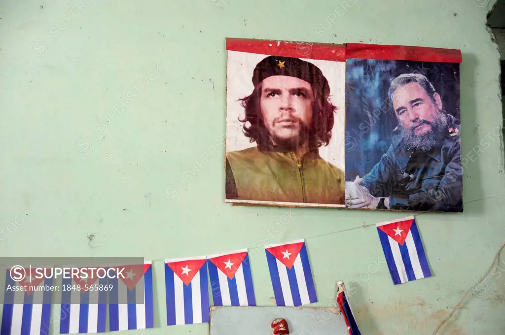 Green wall with national flags made of paper, photos of Che Guevara and Fidel Castro in a store in Havana, Havana, Cuba, Greater Antilles, Caribbean, ...
