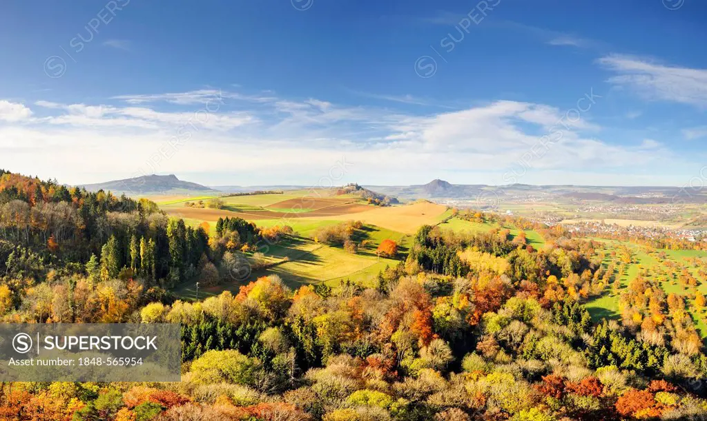 Panoramic view, Hegau landscape in autumn as seen from Hohenkraehen mountain, Maegdeberg mountain on the horizon and Hohenhewen mountain on the right,...