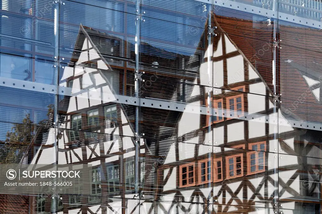 Half-timbered houses reflected in modern glass facade, Benediktplatz square, historic centre of Erfurt, Thuringia, Germany, Europe