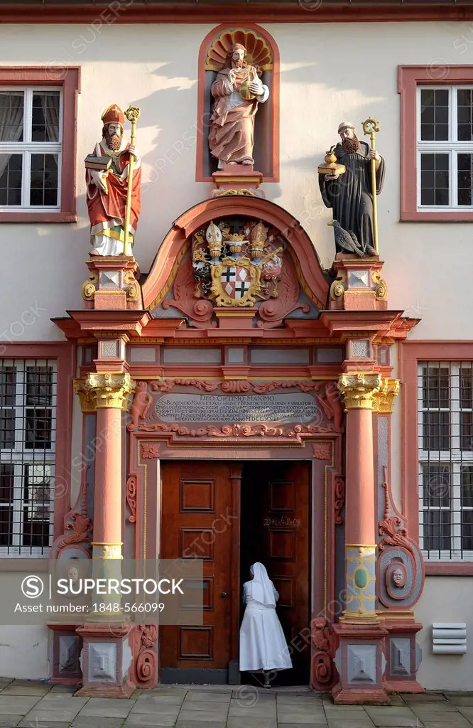 Renaissance portal with the figures of St. Boniface, Jesus Christ and St. Benedict of Nursia, convent building of the former Benedictine monastery at ...