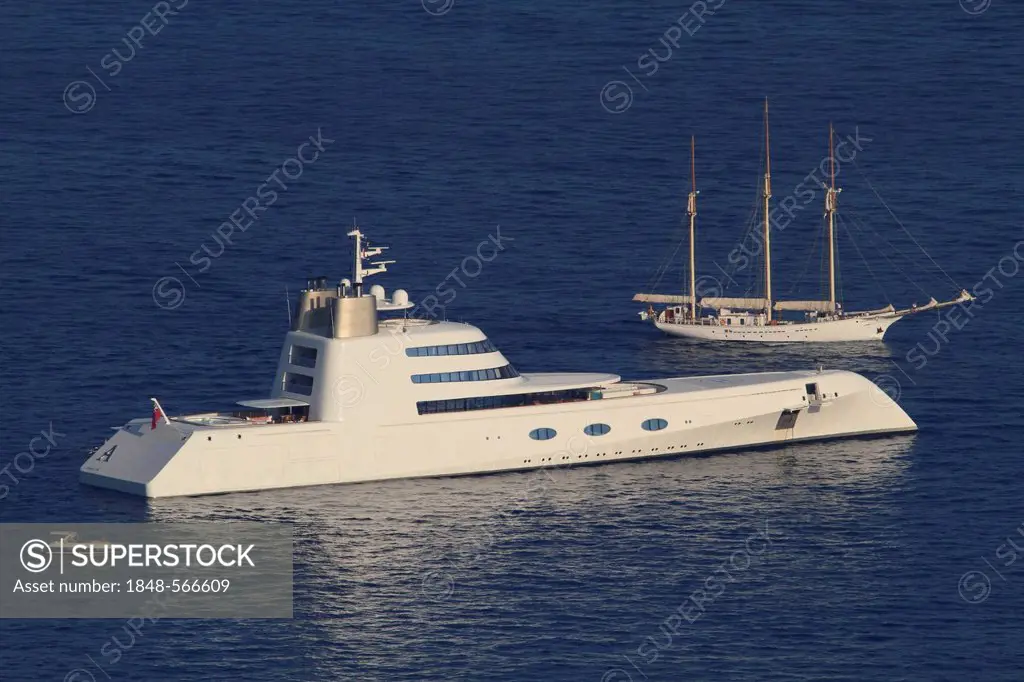 Motor yacht, A, built by Blohm + Voss GmbH, overall length, 119 metres, built in 2008, owned by Andrei Melnichenko, in front of a three-masted sailing...