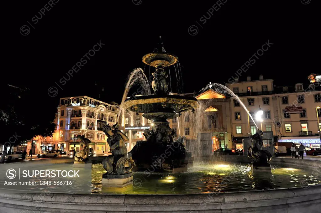 Bronze fountain in Praca Rossio square at night, Baixa, Lisbon, Portugal, Europe