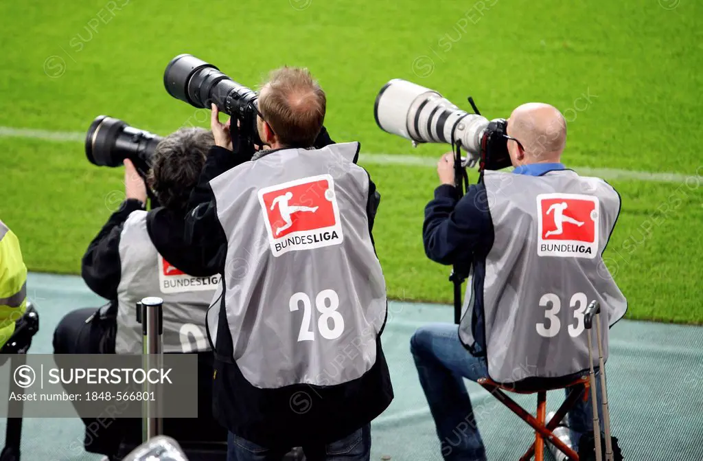 Sports photographers with telephoto lenses on the edge of a football pitch during a second league game, Fortuna Duesseldorf vs Dynamo Dresden, Espirt ...