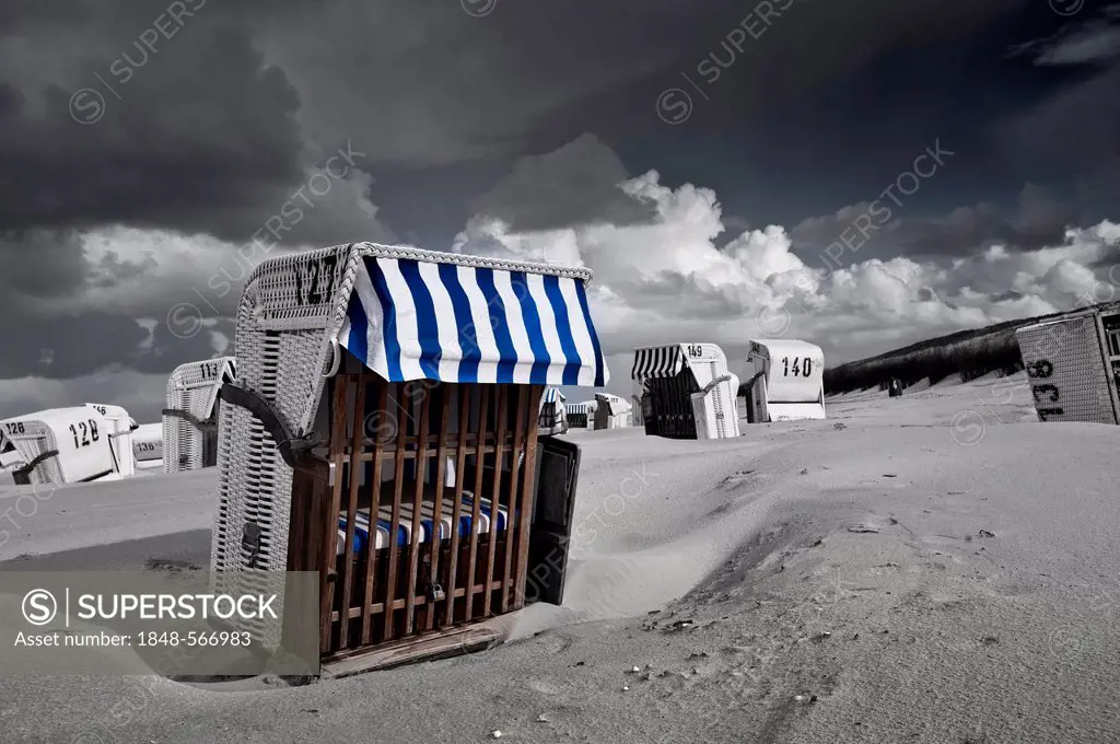 Beach chairs, dramatic clouds in the sky, North Sea beach of Spiekeroog, East Frisia, Lower Saxony, Germany, Europe