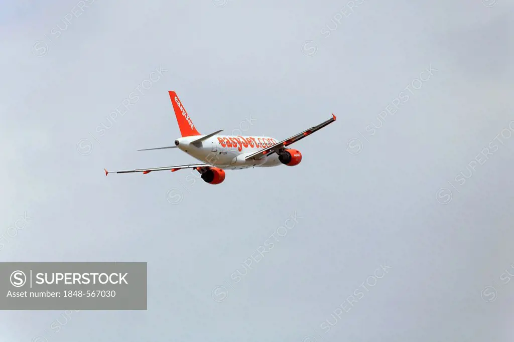 Passenger aircraft Airbus A319 of low-cost airline Easyjet, during climb
