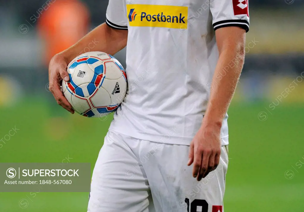 Gladbach player holding football under his arm, German football Bundesliga, VfL Borussia Moenchengladbach vs. SV Werder Bremen 5:0, Nordpark stadion, ...