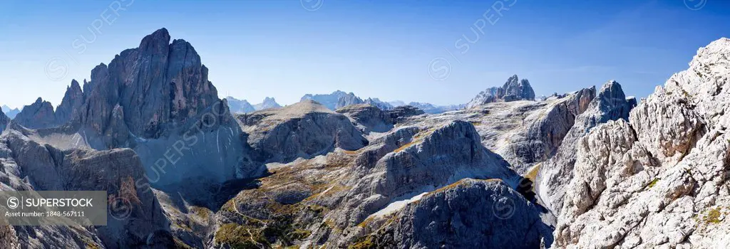 On Elferscharte while ascending the Alpinisteig Climbing Route, view towards Zwoelferkofel Mountain and the Three Peaks at the rear, Sexten, High Pust...
