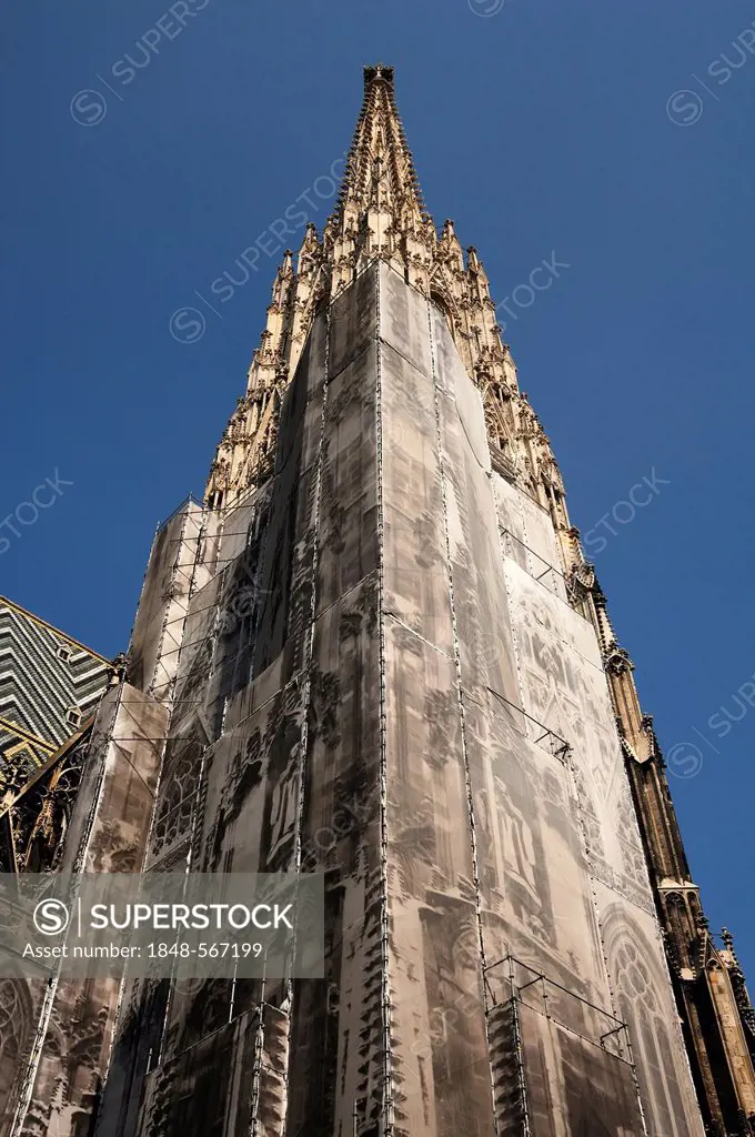 Stephansdom, St. Stephen's Cathedral with scaffolding and a large printed banner, Gothic church steeple, 14th century, Stephansplatz square, Vienna, A...