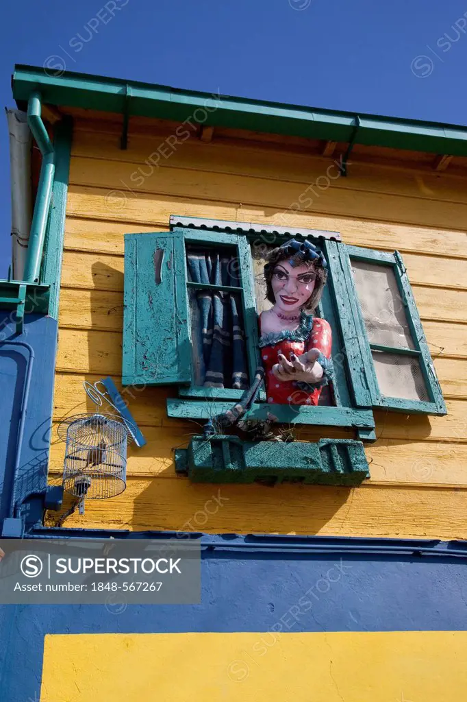 Typical colourful house in the La Boca neighbourhood with large figure of a woman, Buenos Aires, Argentina, South America