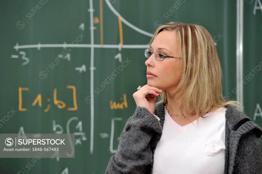 Trainee teacher, prospective teacher, young teacher, pensive, mathematics, blackboard, classroom, Baden-Wuerttemberg, Germany, Europe