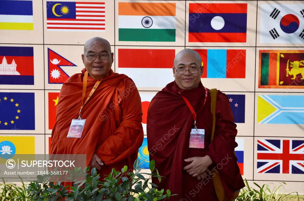 Two monks with red and orange robes, participants of the Global Buddhist Congregation 2011, Buddhist dignitaries from various Buddhist traditions and ...
