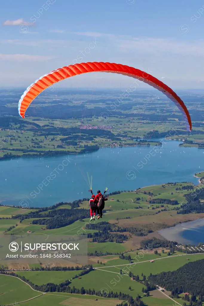 Tandem paragliders overlooking Froggensee lake, Tegelberg Mountain, Upper Bavaria, Bavaria, Germany, Europe, PublicGround