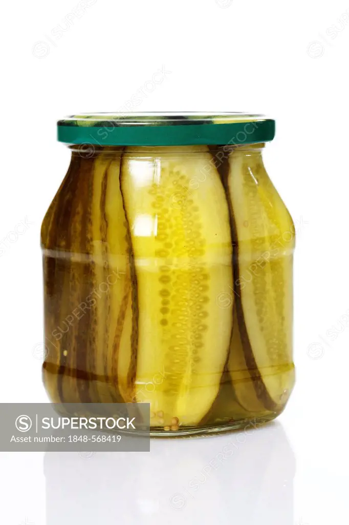 Preserved food, jar of pickles, sliced cucumber