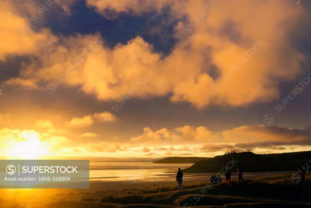 People on the beach watching the clouds, sunset, Atlantic Ocean, Finistère, Brittany, France, Europe