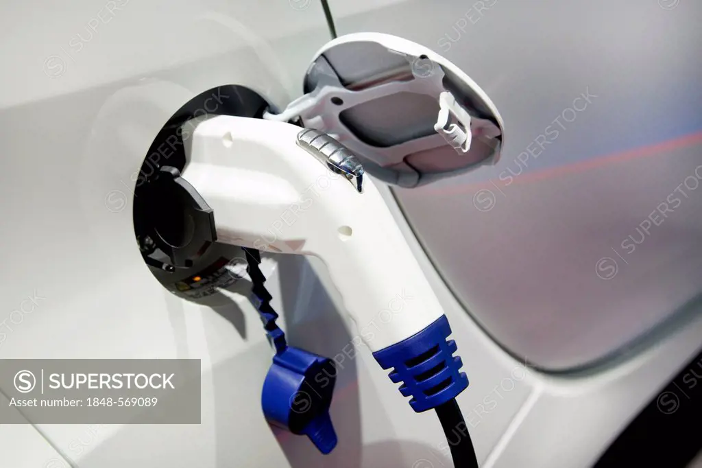 Charging with a 230 volt plug, pistol grip charger, on an electric car, 64th International Motor Show, IAA, 2011, Frankfurt am Main, Hesse, Germany, E...