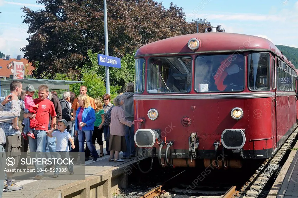Passengers boarding the German Uerdinger railcar in the train station of Bad Laasphe, Siegen Wittgenstein district, North Rhine-Westphalia, Germany, E...