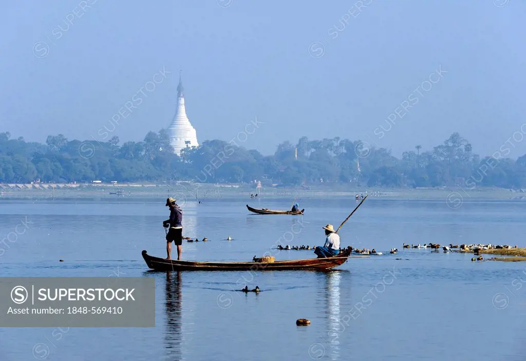 Fishermen in a fishing boat, a pagoda at the back, Burma, Myanmar, Southeast Asia, Asia