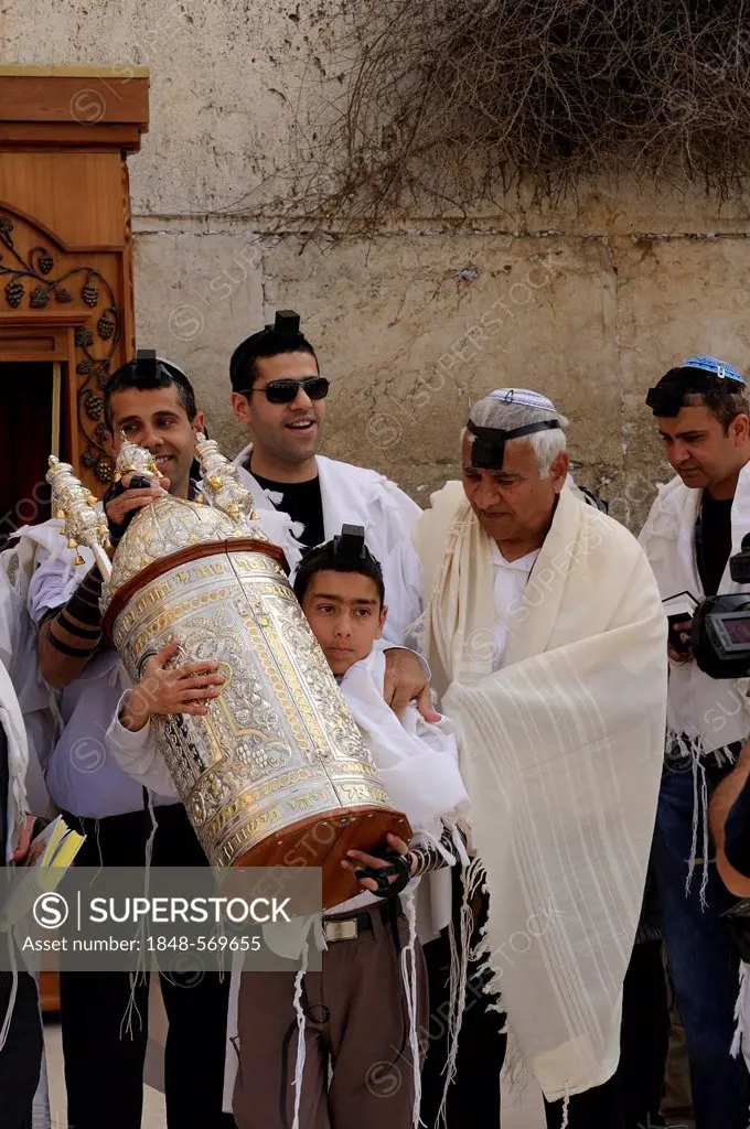 Jewish boy carrying the Torah scroll from the shrine at the Wailing Wall, Western Wall, to a table, Bar Mitzvah celebration, Arab quarter, Jerusalem, ...