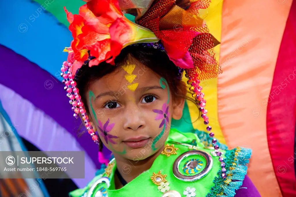 Little girl with a colourful costume at Notting Hill Carnival, costume parade, Notting Hill, London, England, United Kingdom, Europe