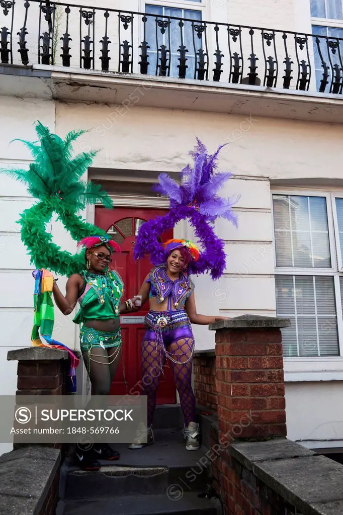 Two young women, Notting Hill Carnival, costume parade, Notting Hill, London, England, United Kingdom, Europe