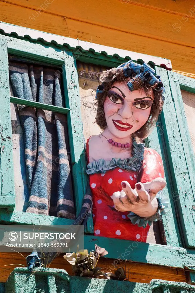 Typical colourful house in the La Boca neighbourhood with large figure of a woman, Buenos Aires, Argentina, South America
