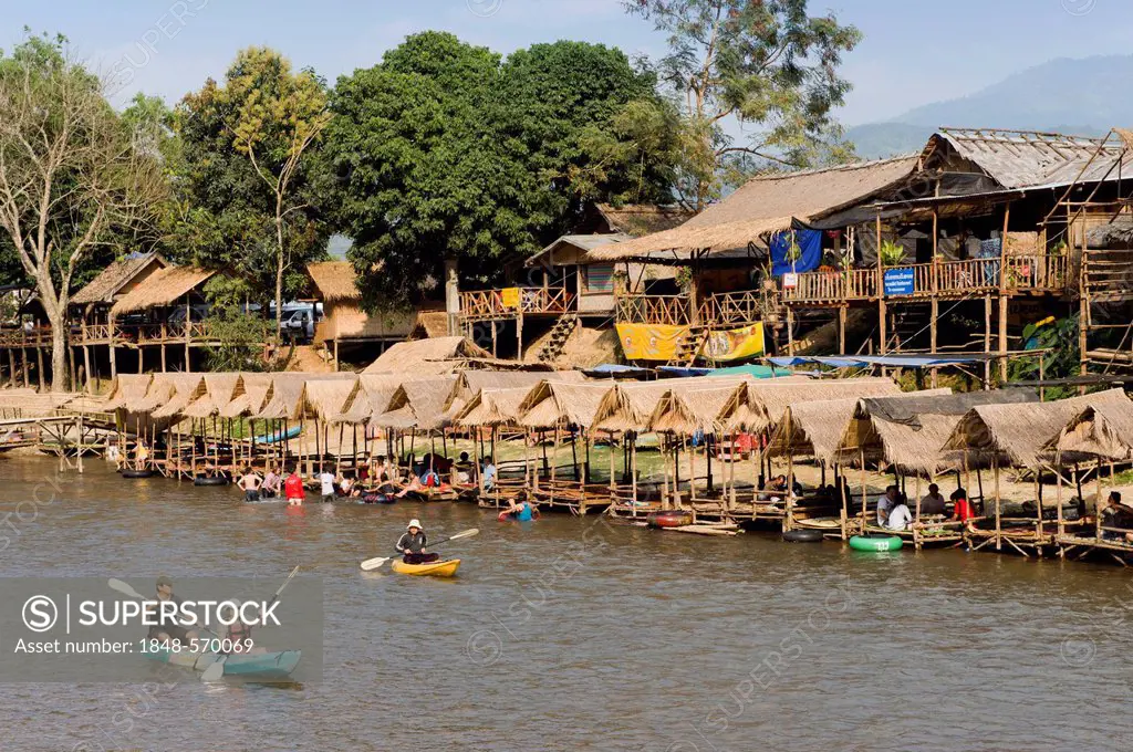 Tourists kayaking in the Water Fun Park on Nam Song River, Vang Vieng, Vientiane, Laos, Indochina, Asia