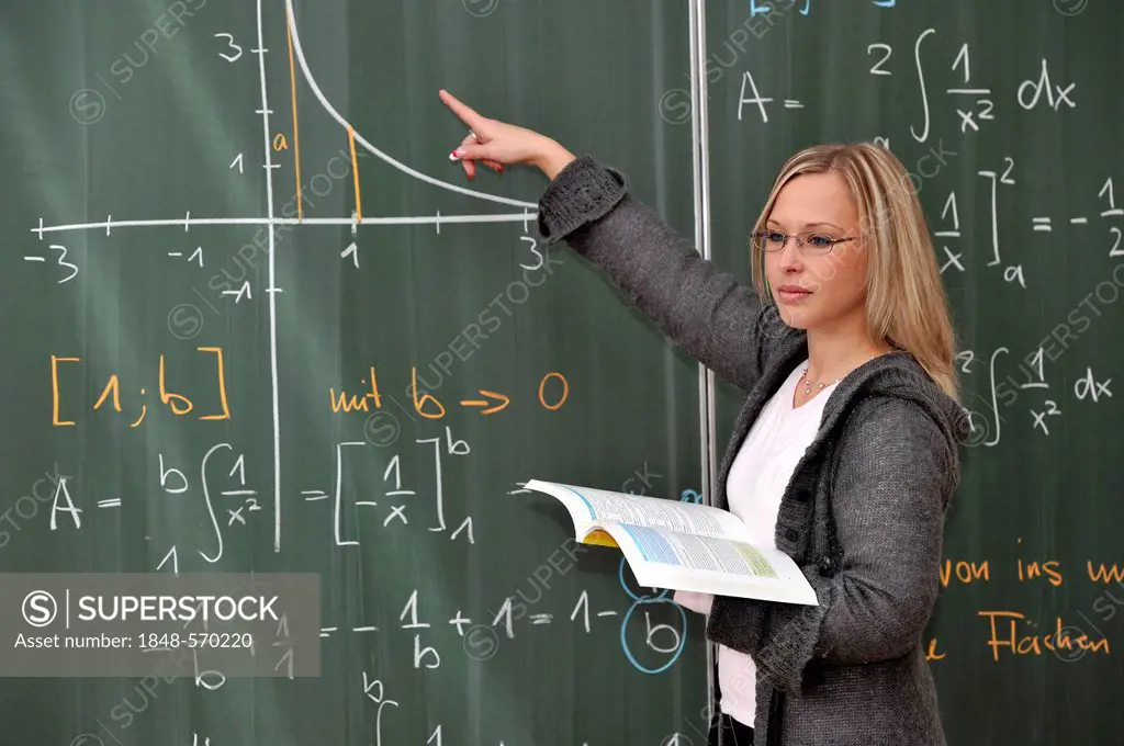 Trainee teacher, prospective teacher, young teacher, mathematics, blackboard, classroom, Baden-Wuerttemberg, Germany, Europe