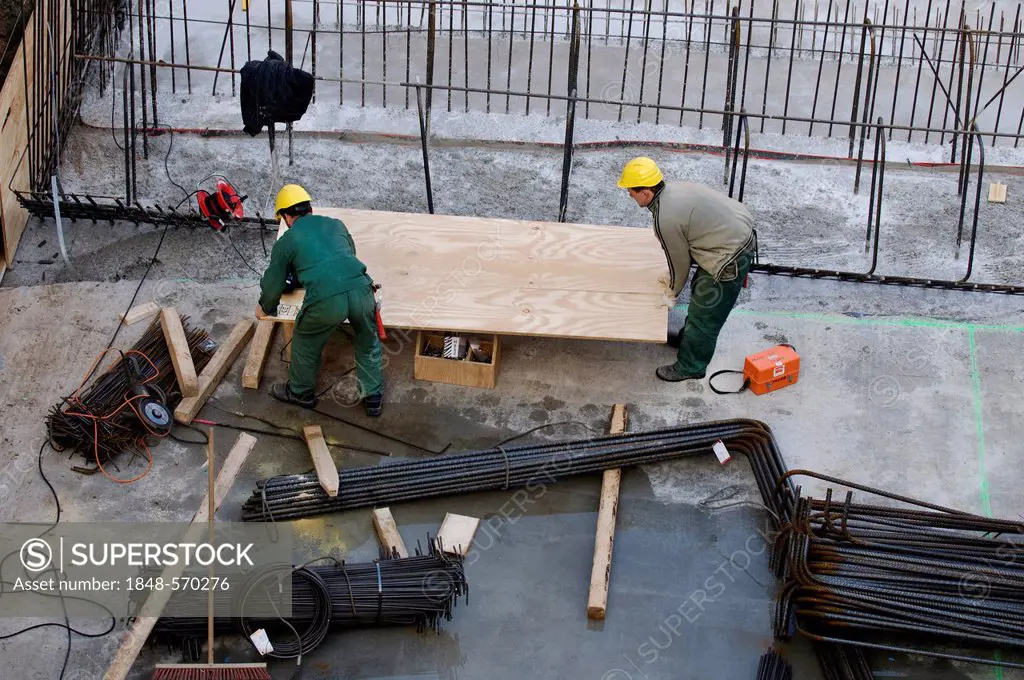 Construction site, workers cutting plywood, North Rhine-Westphalia, Germany, Europe, PublicGround