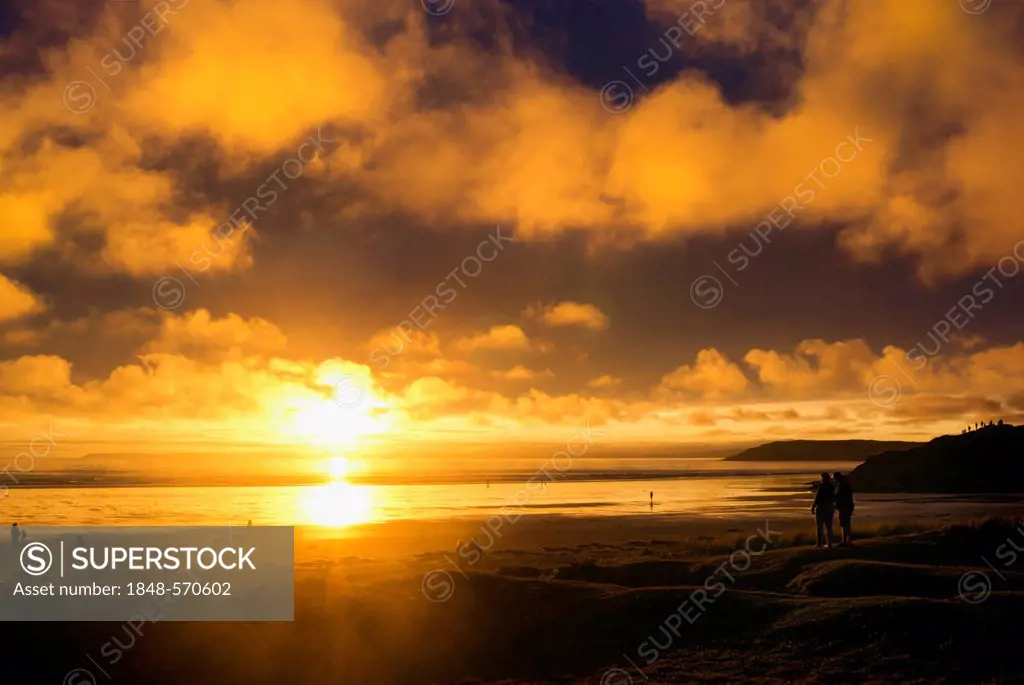 People on the beach watching the clouds, sunset, Atlantic Ocean, Finistère, Brittany, France, Europe