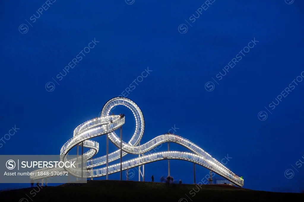 Large-scale sculpture Tiger & Turtle - Magic Mountain designed by Heike Mutter and Ulrich Genth, at dusk, Duisburg, Ruhr Area, North Rhine-Westphalia,...