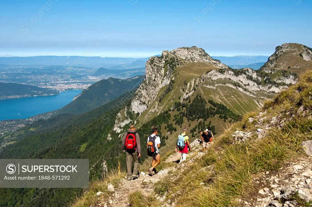 Hikers on the summit of Mt Tournette in the Bornes massif, Massif des Bornes, above Lake Annecy, Lac d'Annecy, Annecy, Savoy, France, Europe