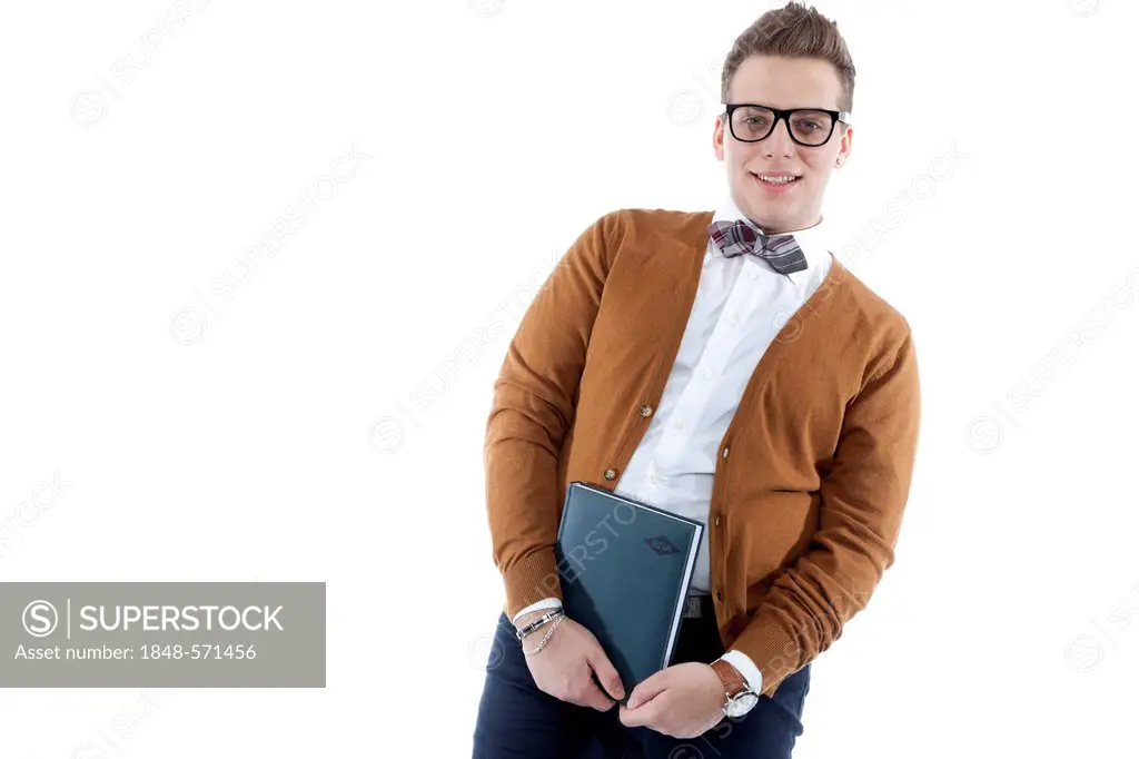 Smiling young man wearing glasses and a bow tie holding an appointment diary