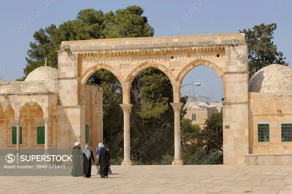 Israeli Palestinian women on the Temple Mount approaching the arcades with Byzantine columns, Al-Mawazin, Muslim Quarter, Old City, Jerusalem, Israel,...