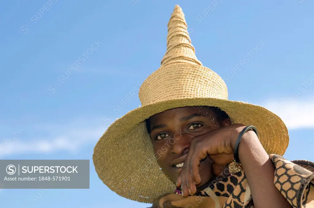 Young Basotho man wearing a traditional hat, portrait, Drakensberg, Kingdom of Lesotho, southern Africa
